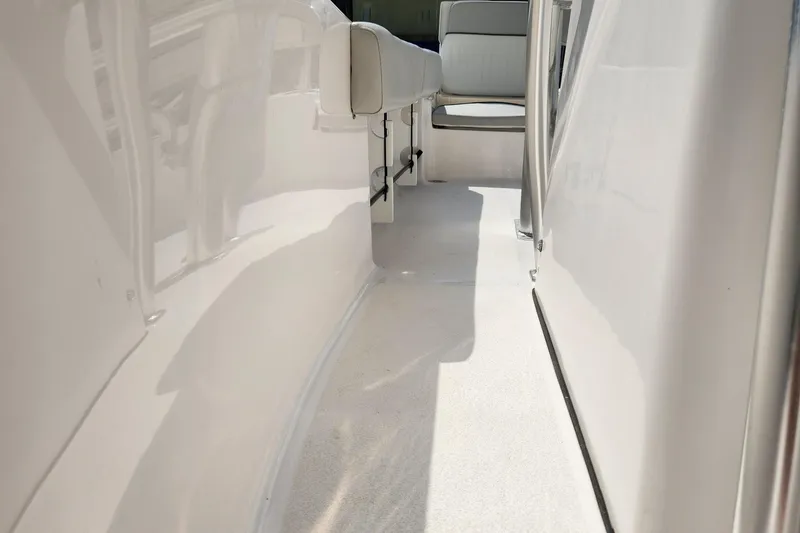 Slide: The Image of 2022 Sea Fox 206 Commander boat interior walkway with seating. - 22