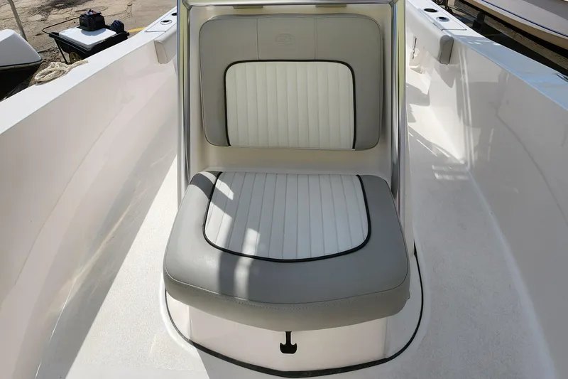 Slide: The Image of 2022 Sea Fox 206 Commander boat seat with white and gray upholstery. - 23