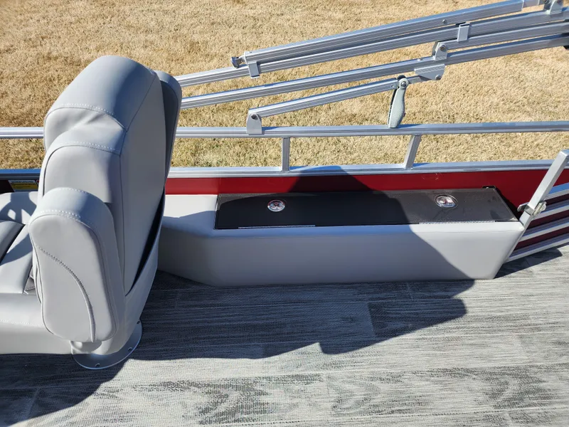 Slide: The Image of 2024 Ranger Reata 220FC boat interior with gray seating and flooring. - 11