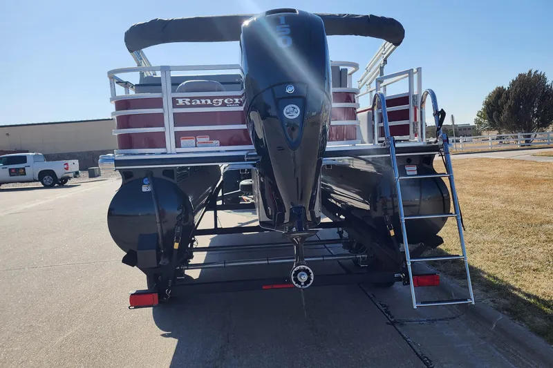 Slide: The Image of 2024 Ranger Reata 220FC pontoon boat with outboard motor and ladder. - 4