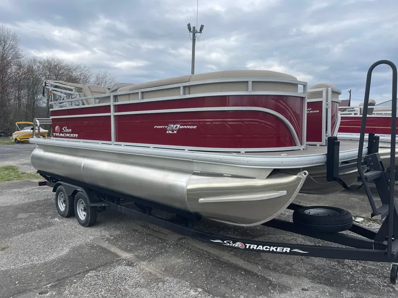 Slide: The Image of 2024 Sun Tracker Party Barge 20 DLX pontoon boat on trailer. - 6