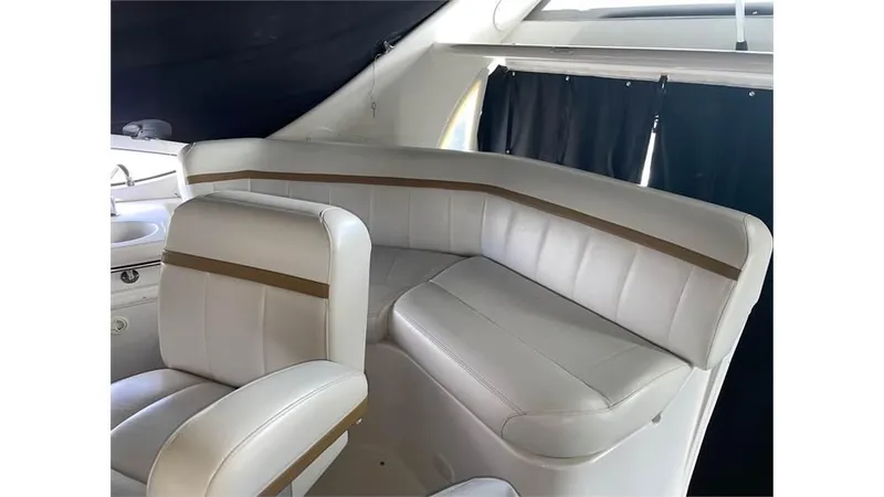 Slide: The Image of Interior seating of 2002 Carver 346 Motor Yacht with white leather upholstery. - 6