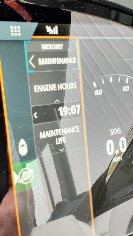 Slide: The Image of Dashboard display of a 2022 Sea Ray SLX 280 showing engine hours and maintenance status. - 15