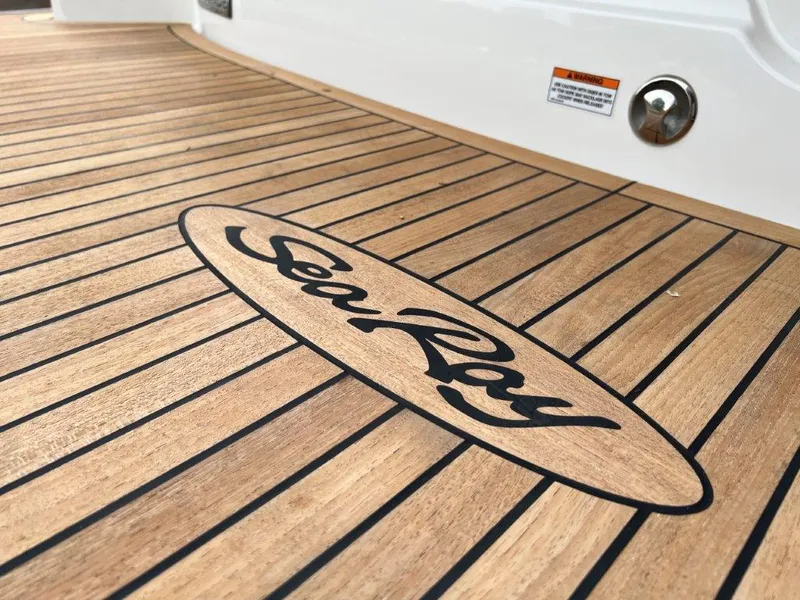 Slide: The Image of Teak deck of 2022 Sea Ray SLX 280 boat with logo. - 17