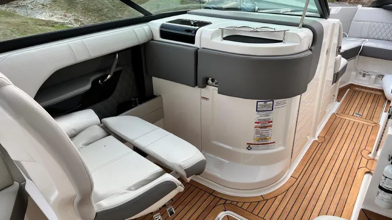 Slide: The Image of 2022 Sea Ray SLX 280 interior with luxurious seating and sleek design. - 5