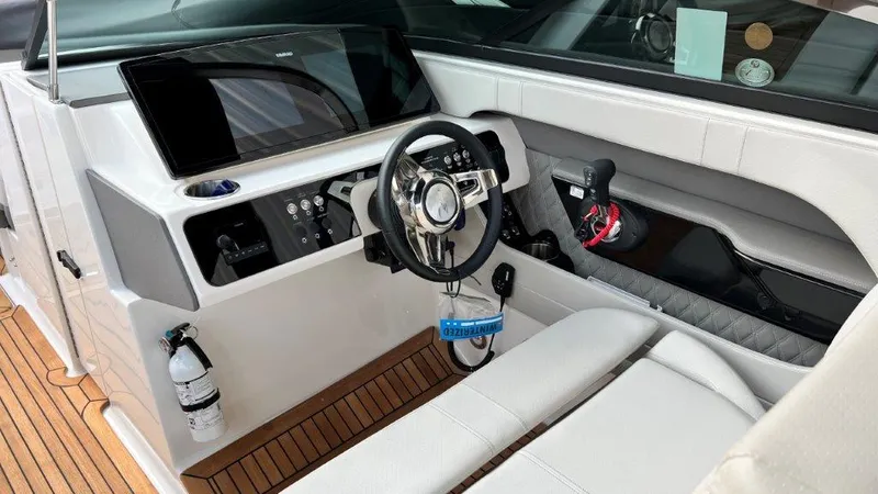 Slide: The Image of 2022 Sea Ray SLX 280 boat cockpit with modern steering and control panel. - 6