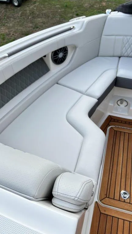 Slide: The Image of Luxurious seating on 2022 Sea Ray SLX 280 boat with teak flooring. - 9