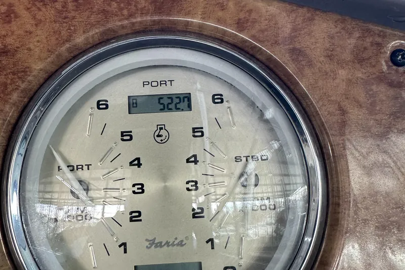 Slide: The Image of Close-up of the 2006 Rinker 360 Express Cruiser engine gauge. - 11