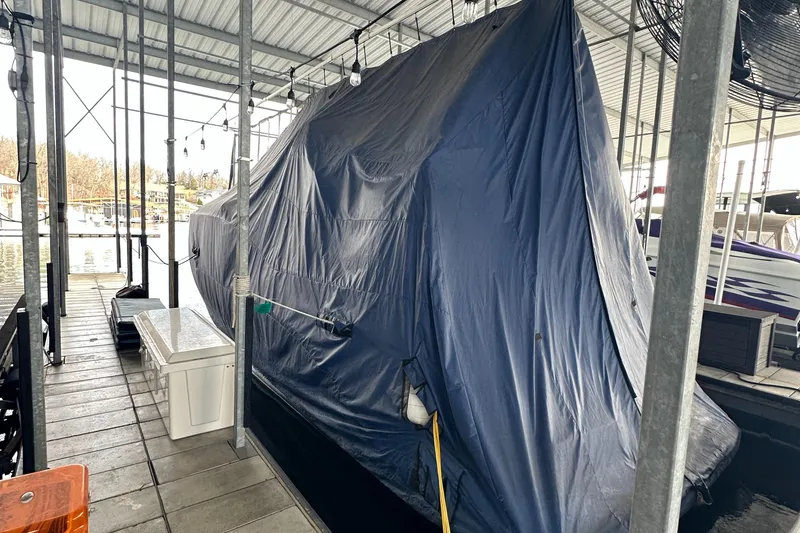 Slide: The Image of 2006 Rinker 360 Express Cruiser covered in a marina dock. - 16