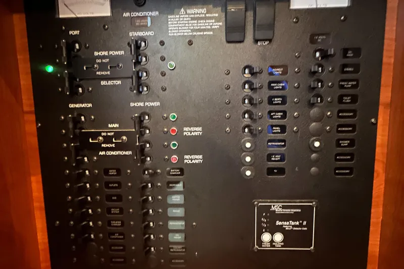 Slide: The Image of Control panel of a 2006 Rinker 360 Express Cruiser boat. - 28