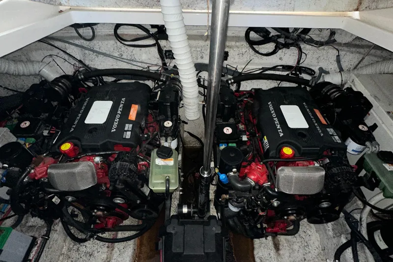 Slide: The Image of 2006 Rinker 360 Express Cruiser engine compartment with twin Volvo Penta engines. - 32