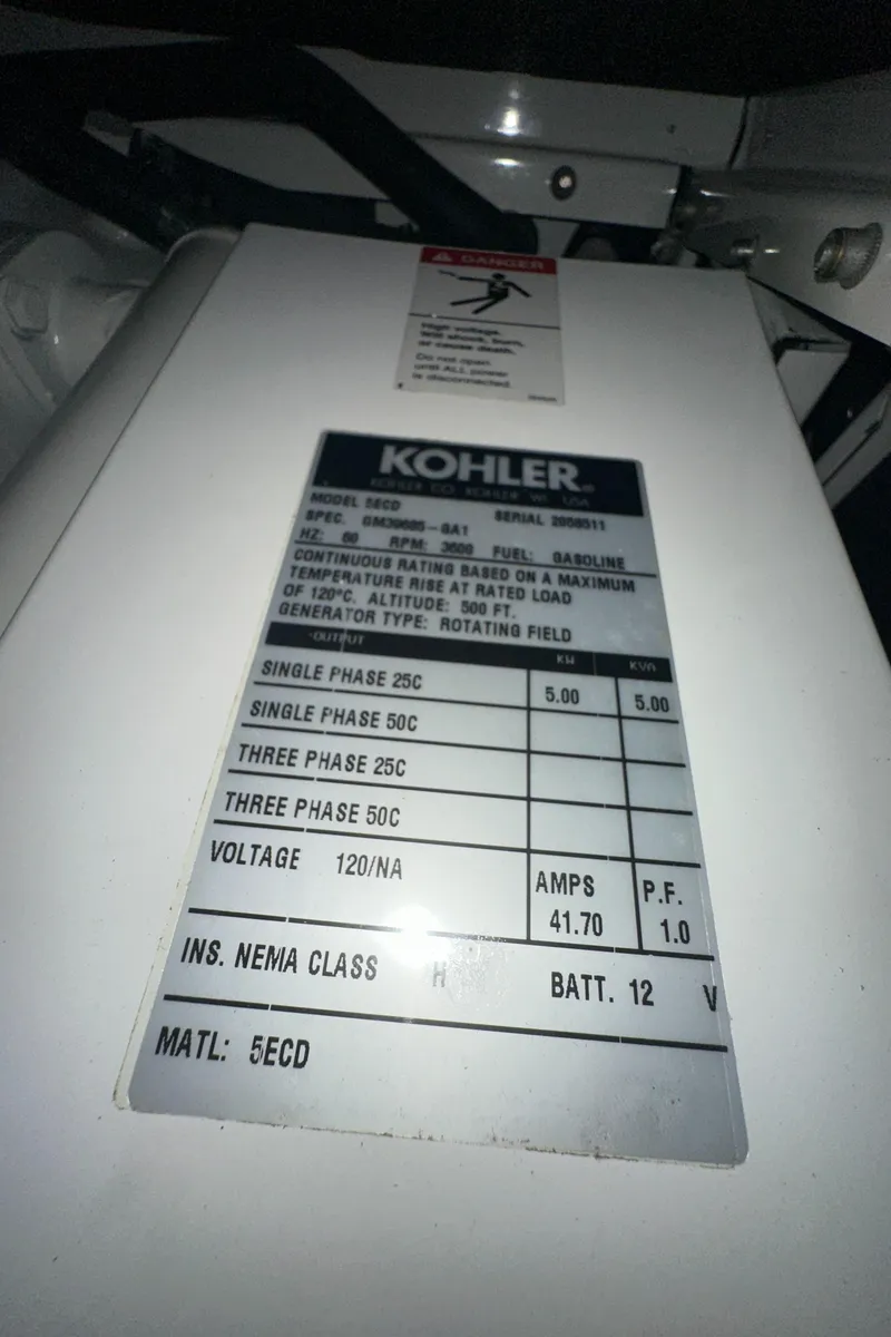 Slide: The Image of Kohler generator label on 2006 Rinker 360 Express Cruiser, showing specifications and voltage details. - 34