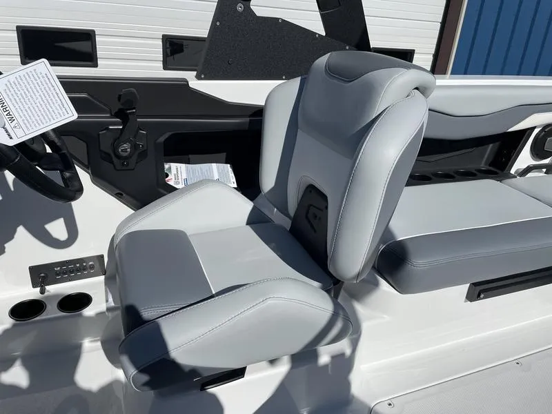 Slide: The Image of 2024 Axis T220-r boat interior with gray and white captain's seat. - 12