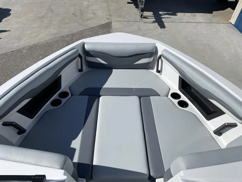 Slide: The Image of 2024 Axis T220-r boat interior with gray seating and cup holders. - 15