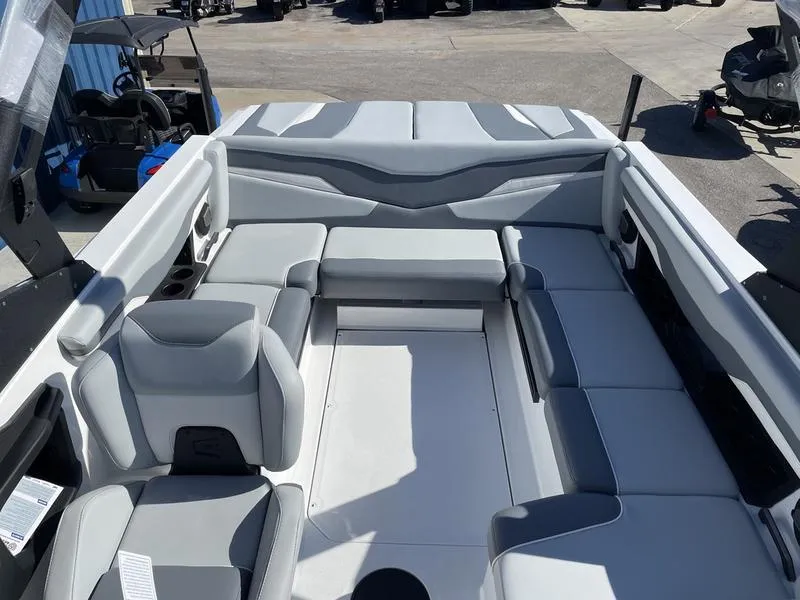 Slide: The Image of 2024 Axis T220-r boat interior with gray and white seating. - 18