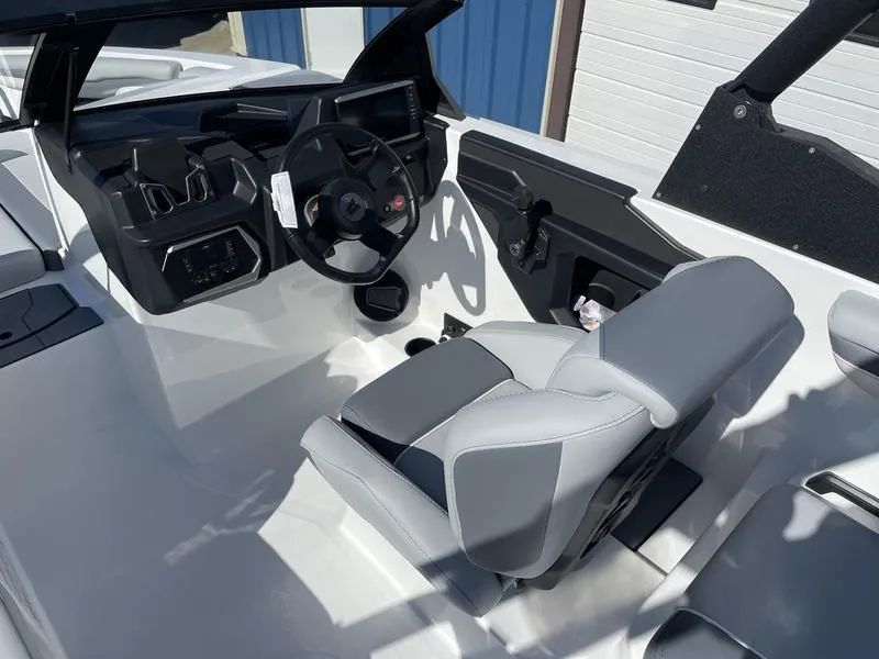 Slide: The Image of 2024 Axis T220-r boat interior with modern dashboard and comfortable seating. - 19
