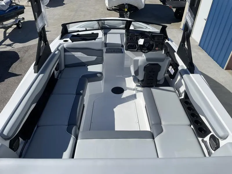 Slide: The Image of 2024 Axis T220-r boat interior with spacious seating and modern dashboard. - 20