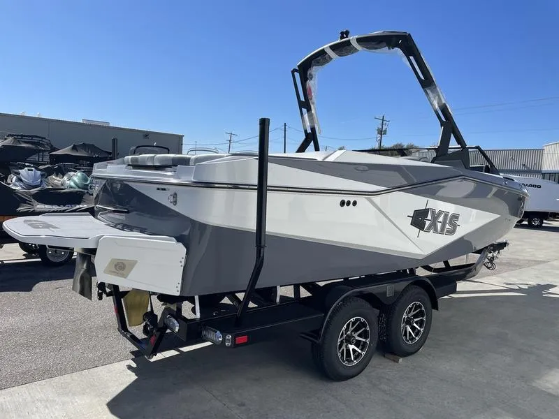 Slide: The Image of 2024 Axis T220-r boat on trailer in outdoor lot. - 4
