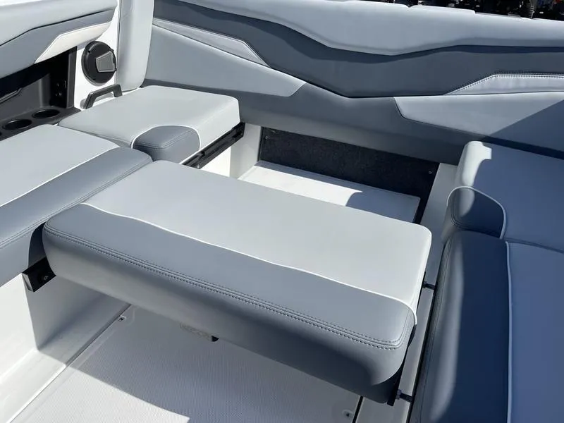 Slide: The Image of 2024 Axis T220-r boat interior with gray cushioned seating. - 7