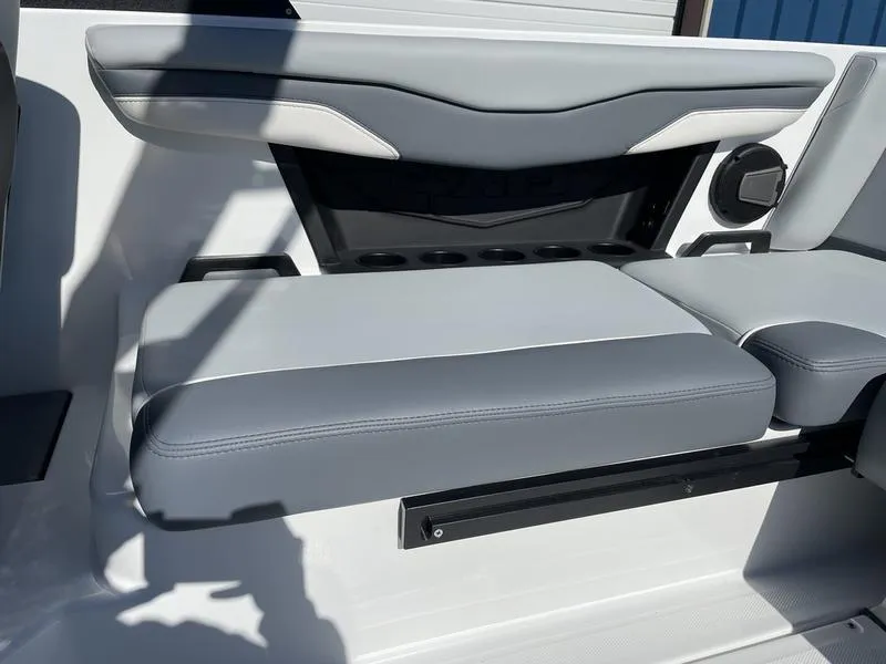 Slide: The Image of 2024 Axis T220-r boat interior with gray and white cushioned seating. - 8