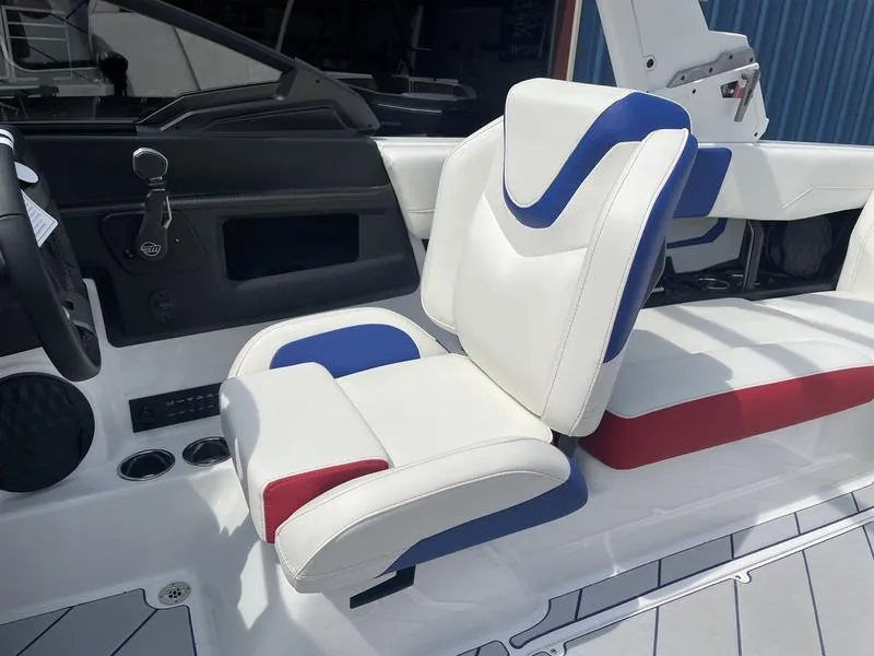 Slide: The Image of 2024 Malibu 22 LSV boat interior with white, blue, and red seating. - 14