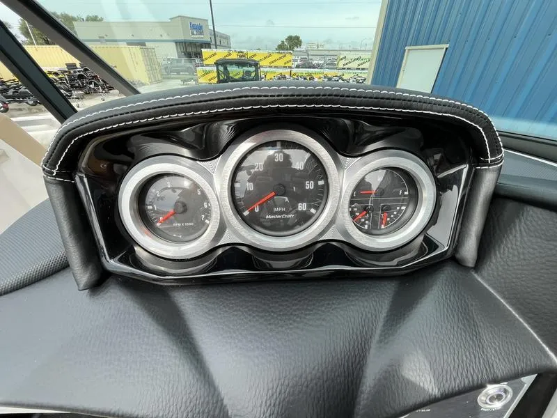 Slide: The Image of 2024 MasterCraft XT20 dashboard with speedometer, tachometer, and fuel gauge. - 10