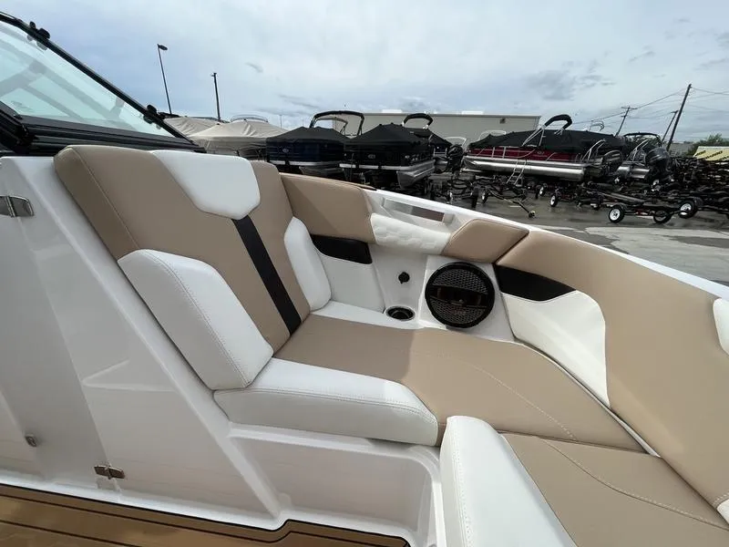 Slide: The Image of 2024 MasterCraft XT20 boat interior with beige and white seating. - 11