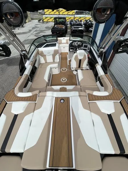 Slide: The Image of 2024 MasterCraft XT20 boat interior with luxurious seating and modern design. - 12