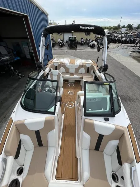 Slide: The Image of 2024 MasterCraft XT20 boat with luxurious seating and teak flooring. - 17