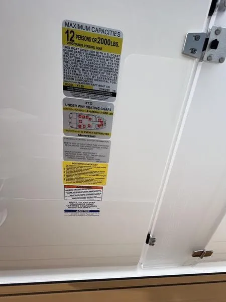 Slide: The Image of 2024 MasterCraft XT20 capacity label, maximum 12 persons or 2000 lbs. - 18