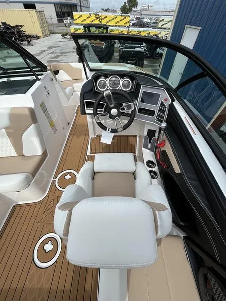Slide: The Image of 2024 MasterCraft XT20 boat cockpit with modern dashboard and luxurious seating. - 20