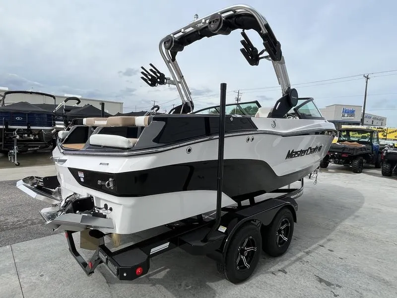 Slide: The Image of 2024 MasterCraft XT20 boat on a trailer, rear view. - 3