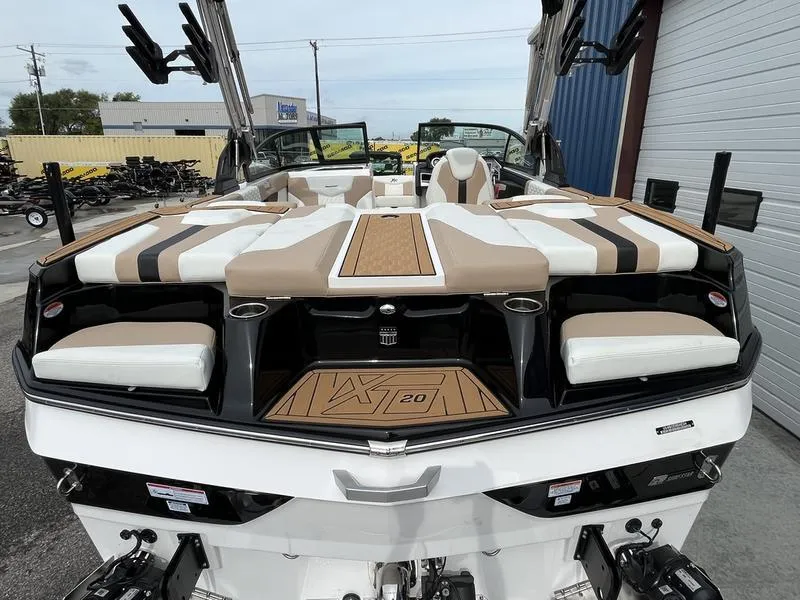 Slide: The Image of 2024 MasterCraft XT20 boat with luxurious seating and modern design. - 5