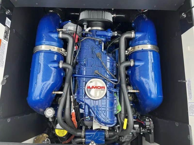 Slide: The Image of 2024 MasterCraft XT20 Ilmor engine with blue components. - 6