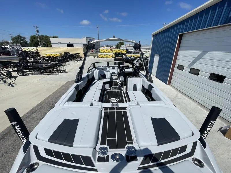 Slide: The Image of 2023 Malibu 24 MXZ boat with sleek interior design. - 9