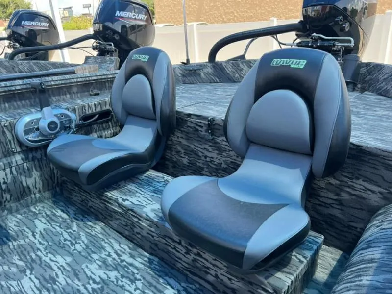 Slide: The Image of 2024 Havoc Boats 1756 FRRSC interior with dual seats and Mercury engines. - 5