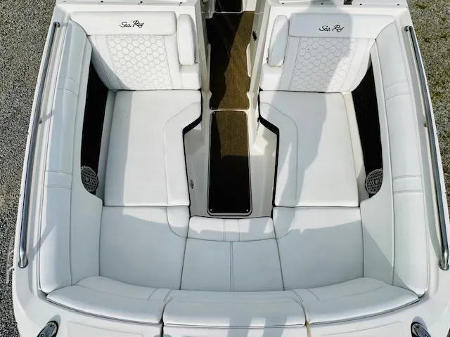 Slide: The Image of 2018 Sea Ray 270 SDX boat interior with white seating and elegant design. - 11