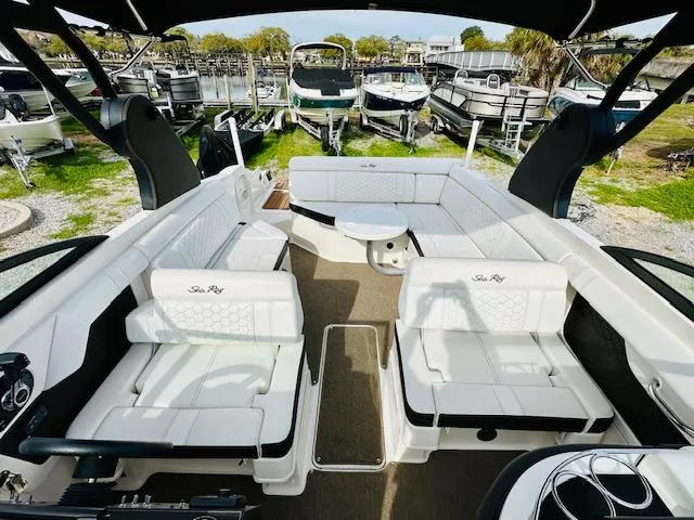 Slide: The Image of 2018 Sea Ray 270 SDX boat interior with white seating and modern design. - 13