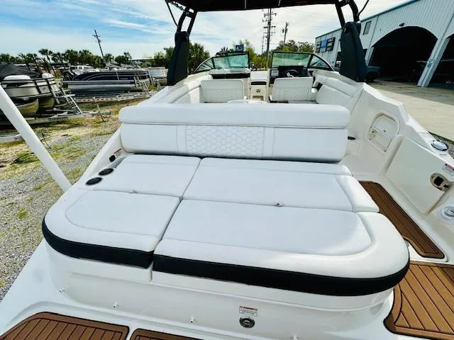 Slide: The Image of 2018 Sea Ray 270 SDX boat with spacious white seating and teak flooring. - 18