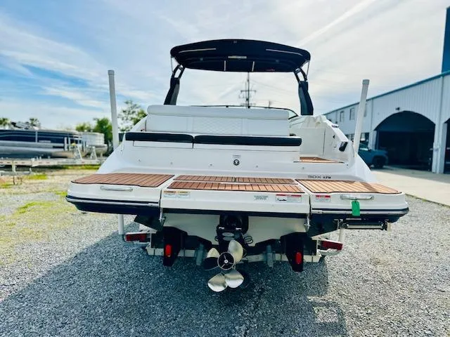 Slide: The Image of Rear view of 2018 Sea Ray 270 SDX boat with teak swim platform. - 2