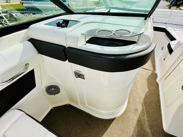 Slide: The Image of Interior view of 2018 Sea Ray 270 SDX boat, featuring cup holders and seating area. - 21