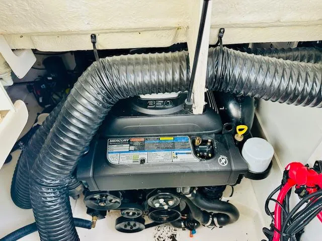 Slide: The Image of Engine compartment of a 2018 Sea Ray 270 SDX boat, featuring a MerCruiser 350 engine. - 27