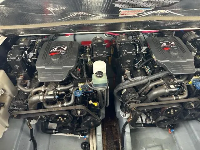 Slide: The Image of Twin engines of a 2003 Sea Ray 280 Sundancer boat. - 18