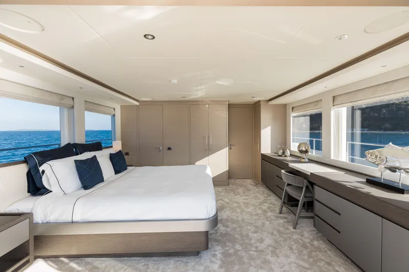Slide: The Image of Luxurious bedroom interior on 2025 Nomad 95 SUV yacht with ocean view. - 10