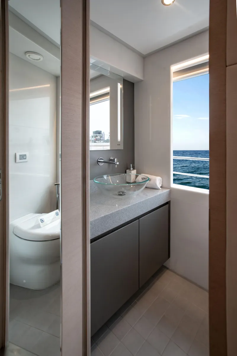 Slide: The Image of Luxurious bathroom in 2025 Nomad 95 SUV yacht with ocean view. - 17
