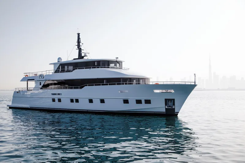 Slide: The Image of Luxury Nomad 95 SUV yacht cruising on calm waters, 2025 model. - 25