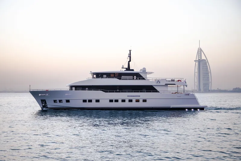 Slide: The Image of Luxury Nomad 95 SUV yacht cruising near iconic Dubai skyline, 2025 model. - 29