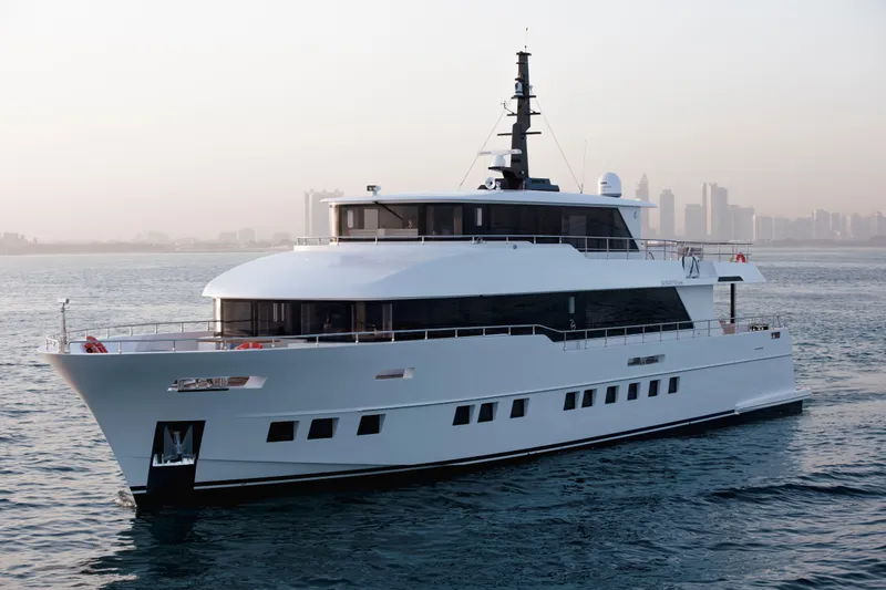 Slide: The Image of Luxury Nomad 95 SUV yacht cruising on calm waters, 2025 model. - 31