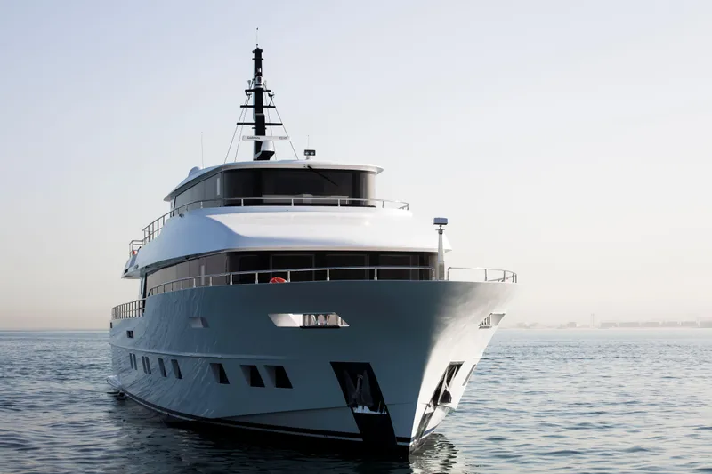 Slide: The Image of Luxury Nomad 95 SUV yacht on calm sea, 2025 model. - 32