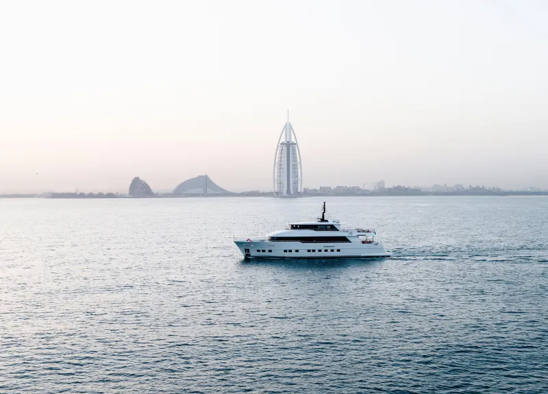 Slide: The Image of Luxury Nomad 95 SUV yacht cruising near iconic Dubai skyline, 2025. - 35